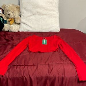 I’m selling this bright red cropped long sleeve